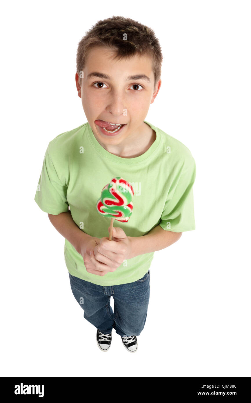 Boy with lollipop licking lips Stock Photo