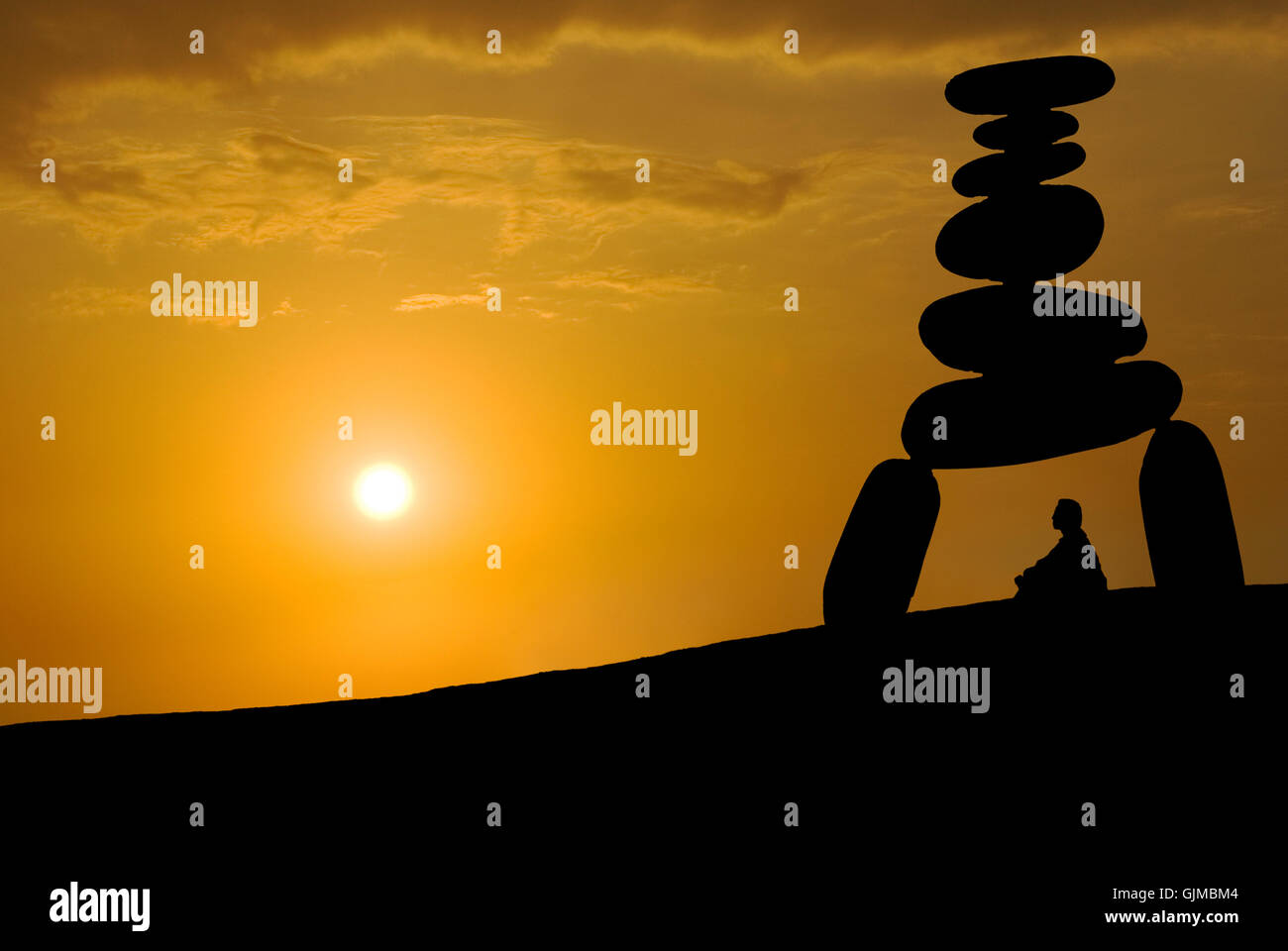 Face huge stress, meditation under sunset Stock Photo
