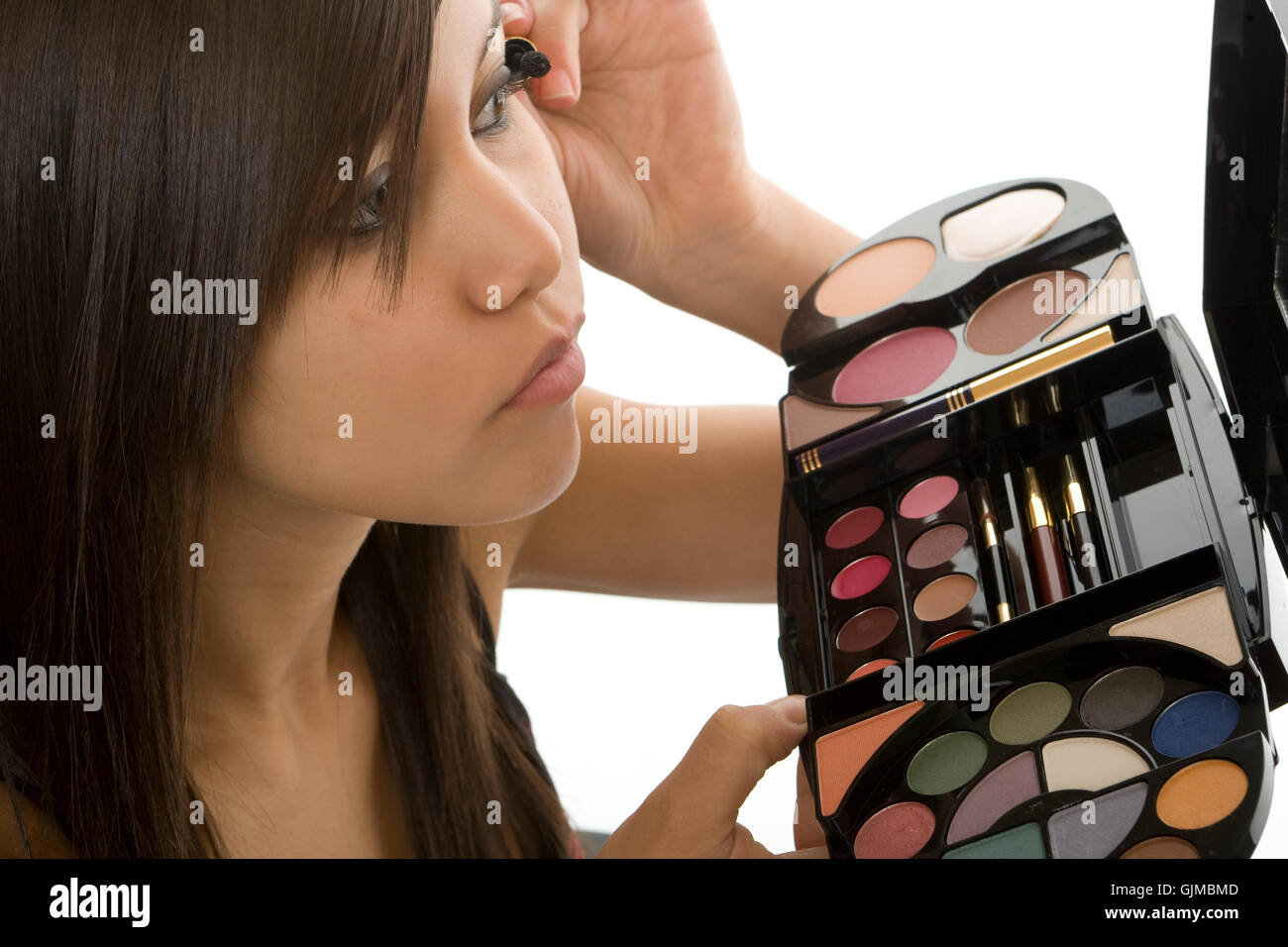 teenager applying makeup Stock Photo
