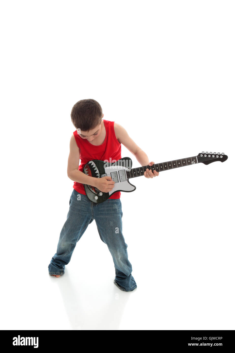 Little boy playing a guitar Stock Photo