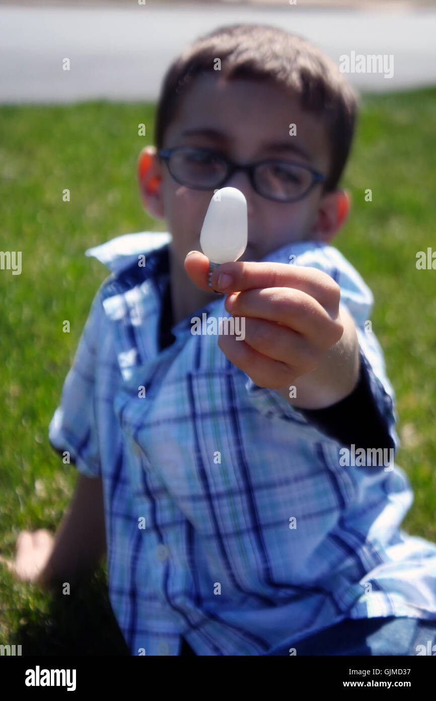 child holding light bulb Stock Photo Alamy