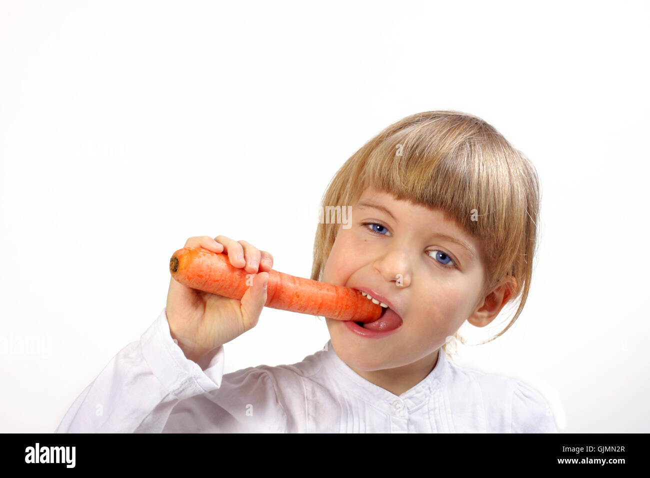 carrot bite off bite into Stock Photo