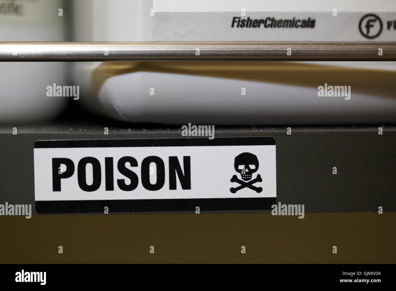 Poison label on chemical shelf in laboratory Stock Photo