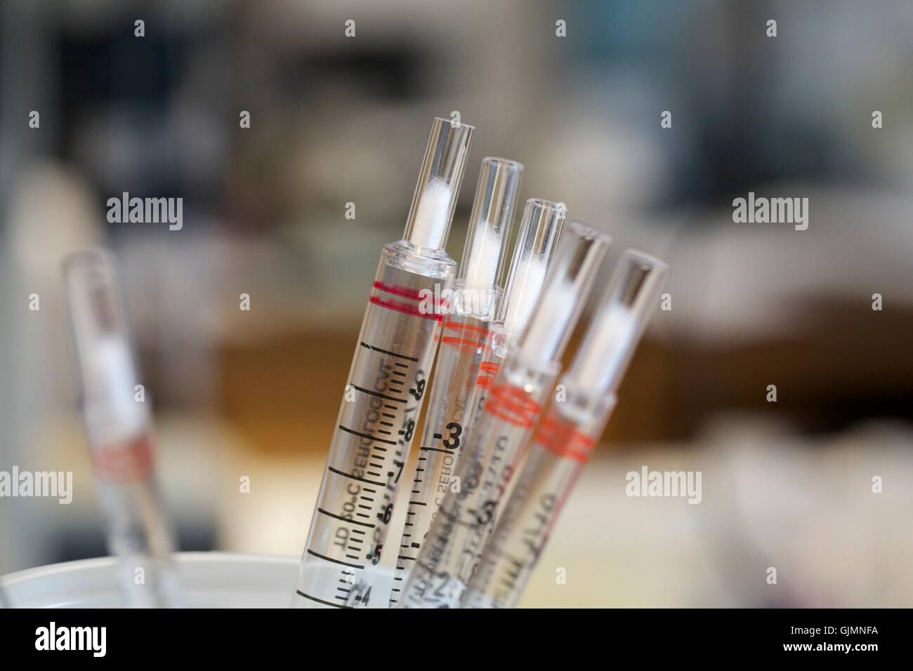 Plastic disposable pipets in research laboratory Stock Photo