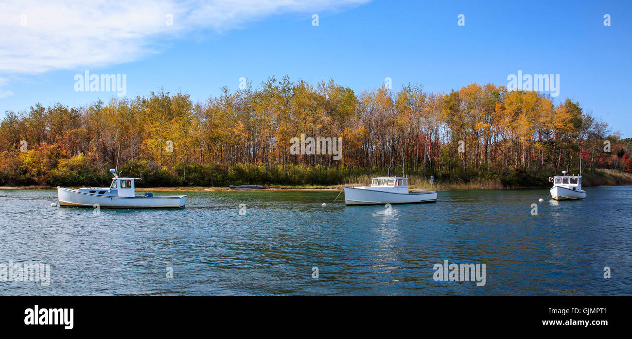 Lobster boats at rest on a sunny autumn morning in Kennebunkport Harbor