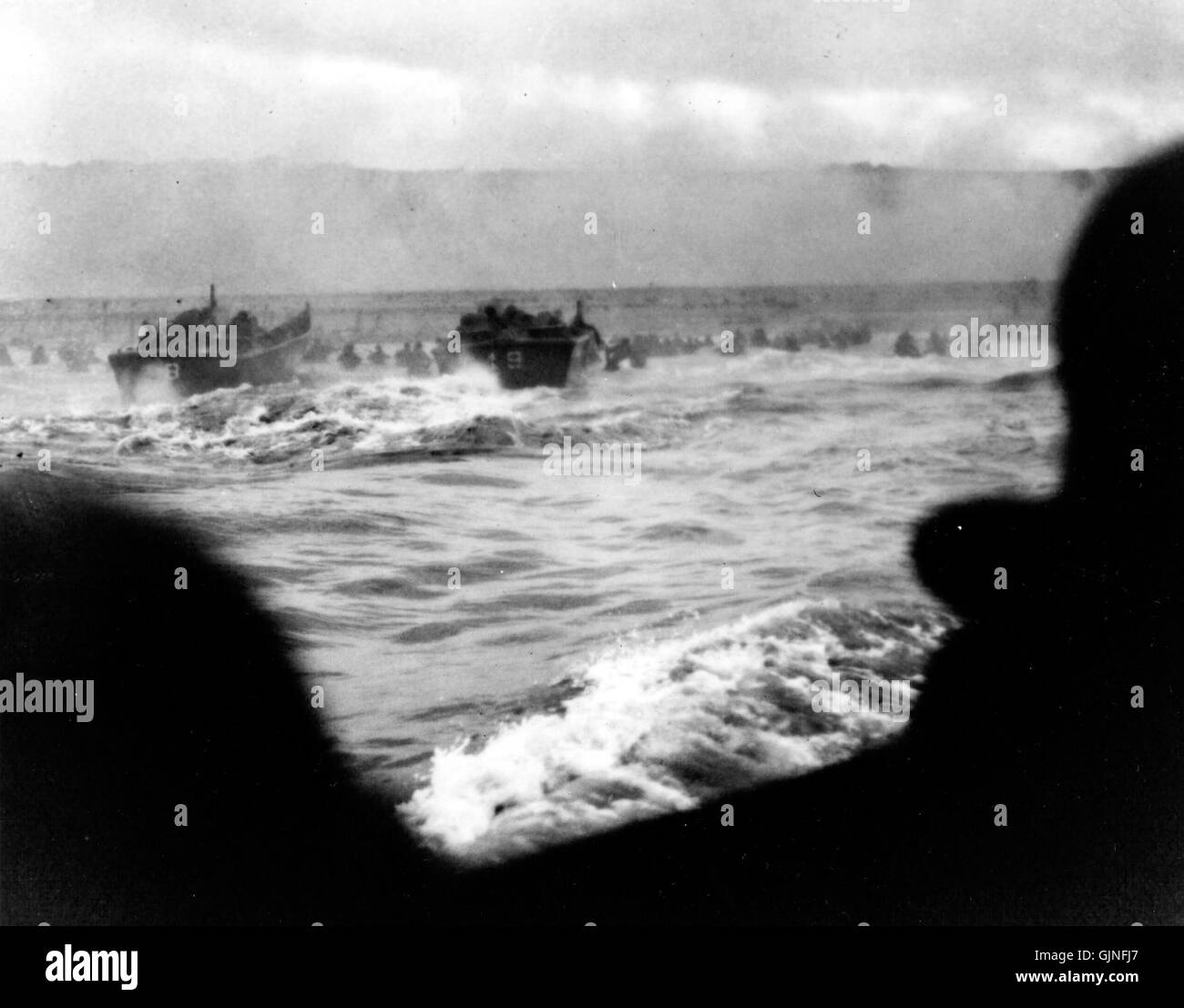 This refers to the first wave of Allied forces landing at Omaha Beach ...