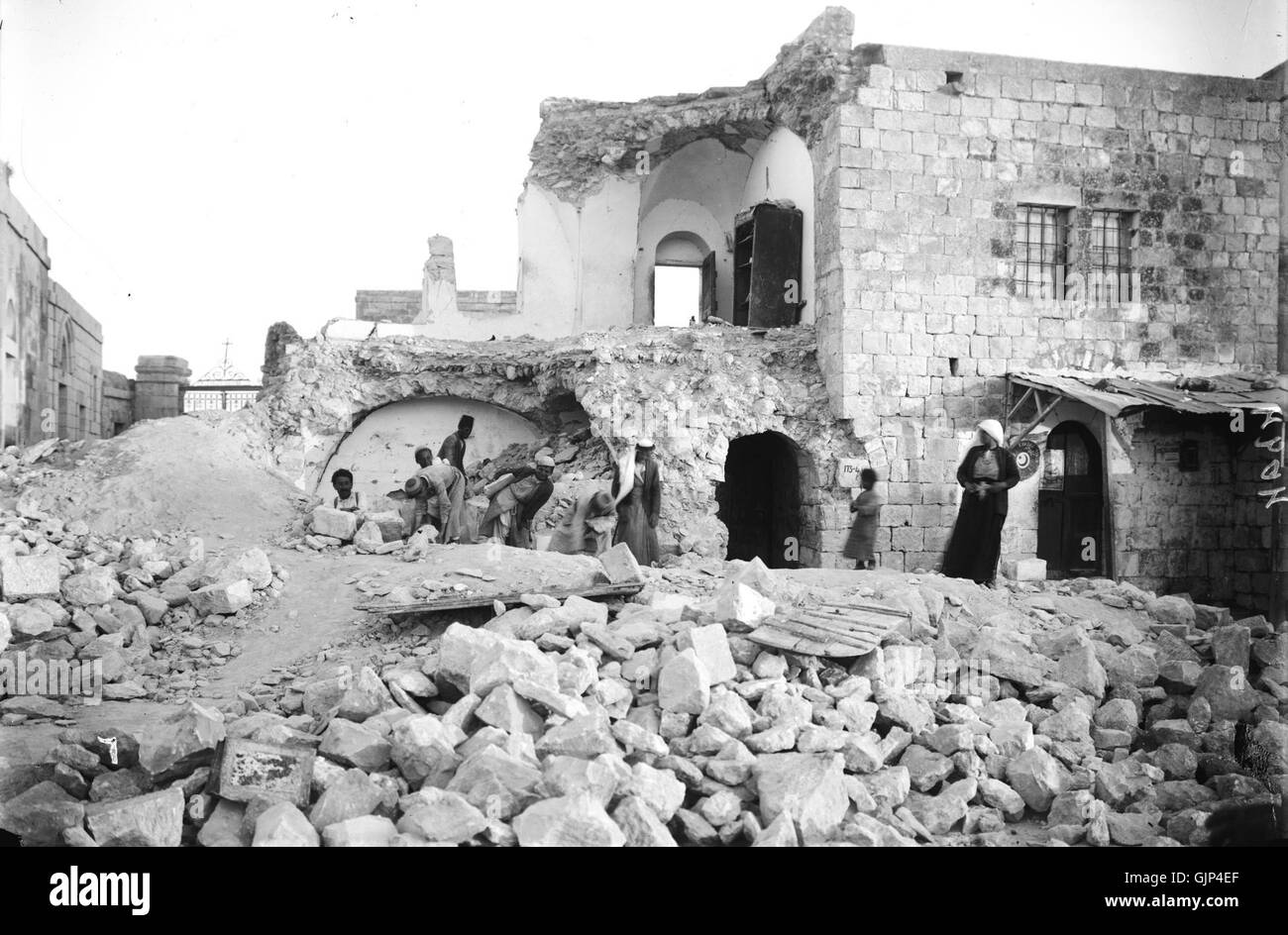 This historical photograph depicts the aftermath of the 1927 earthquake at Olive Mount. It shows the destruction and the resilience of the community during recovery efforts. Stock Photo