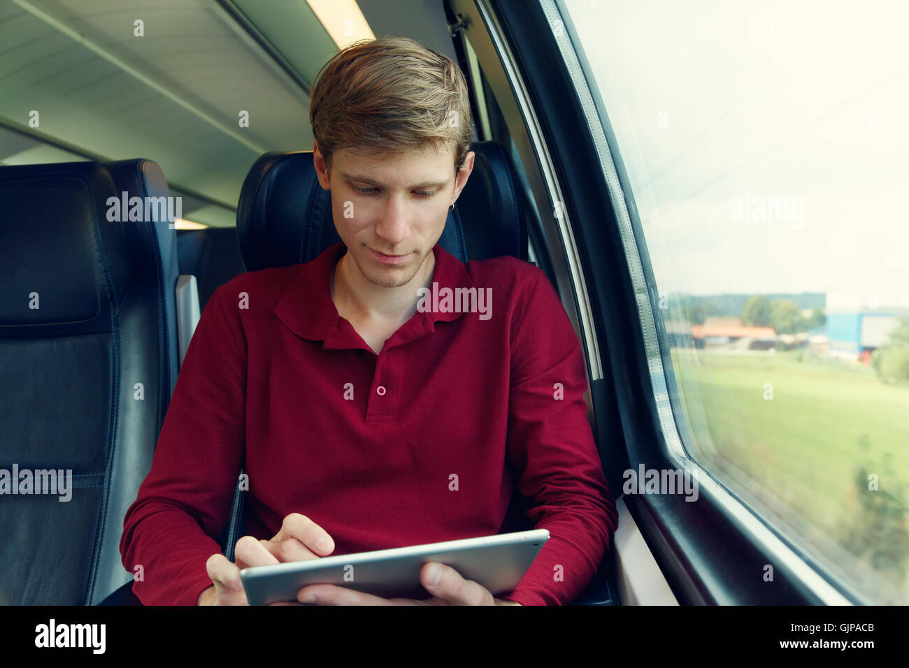 handsome man riding on a train Stock Photo