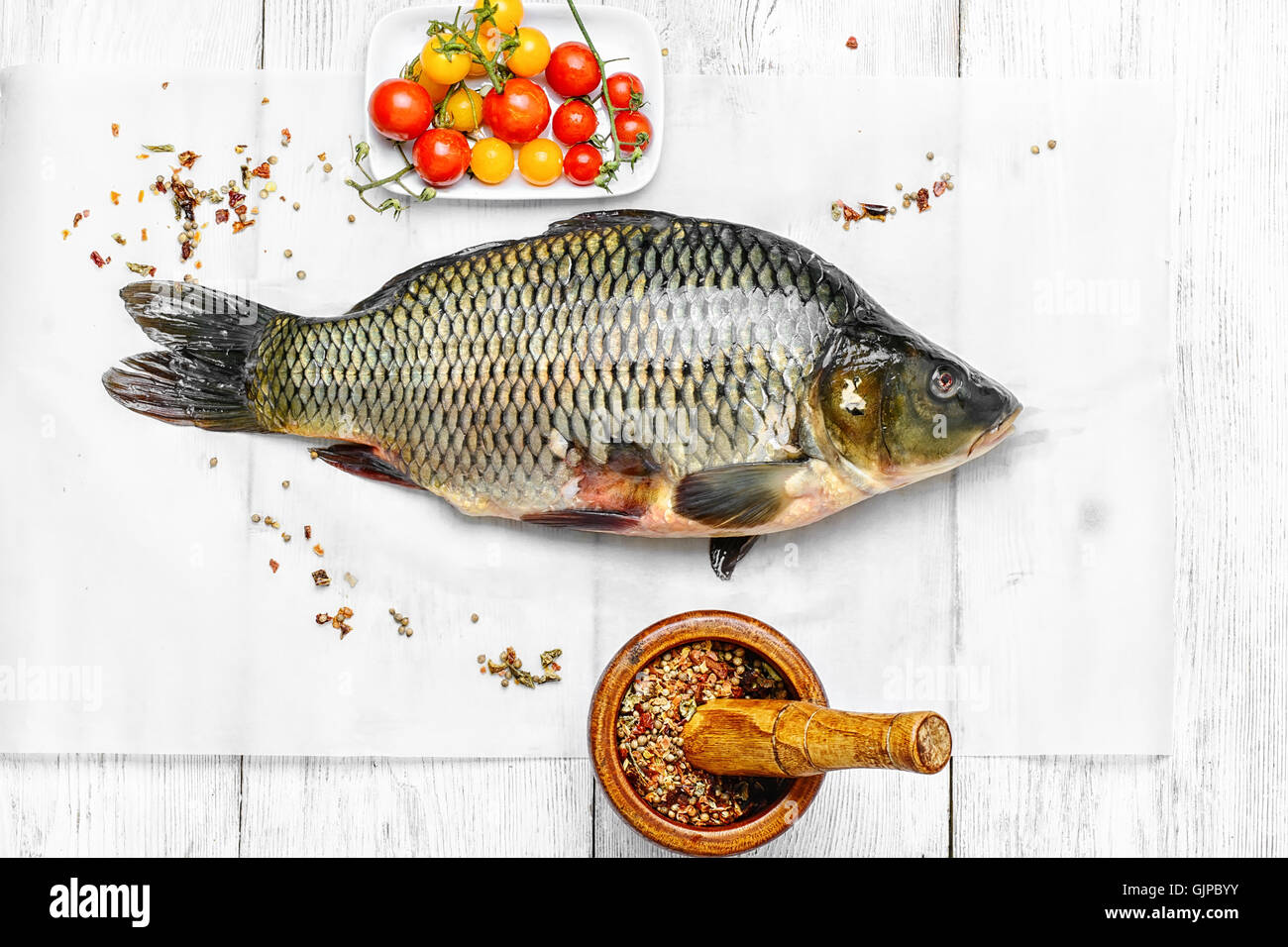 process of cooking processing of fish caught carp to bake Stock Photo
