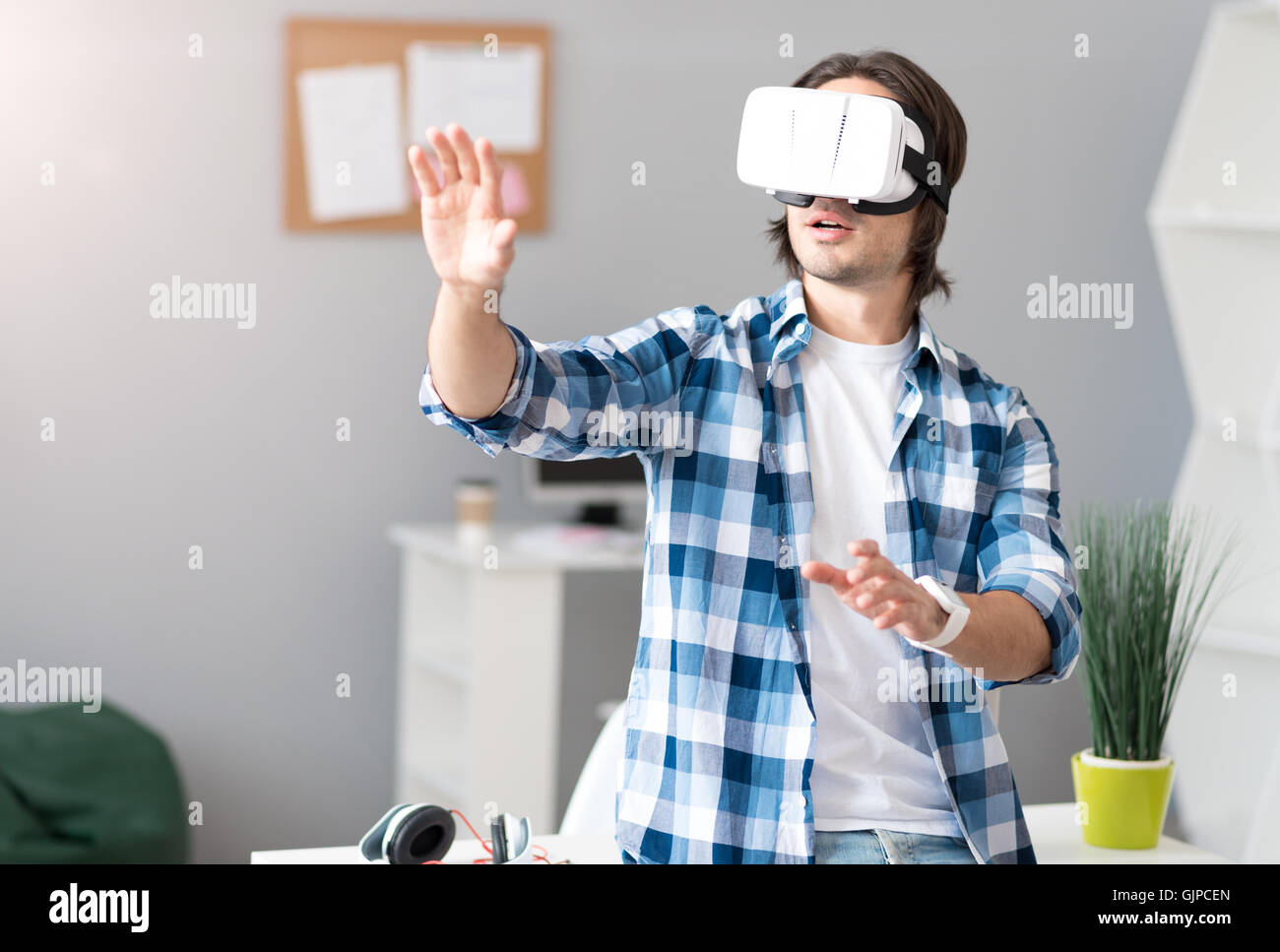 Pleasant handsome man using hi-res stock photography and images - Alamy