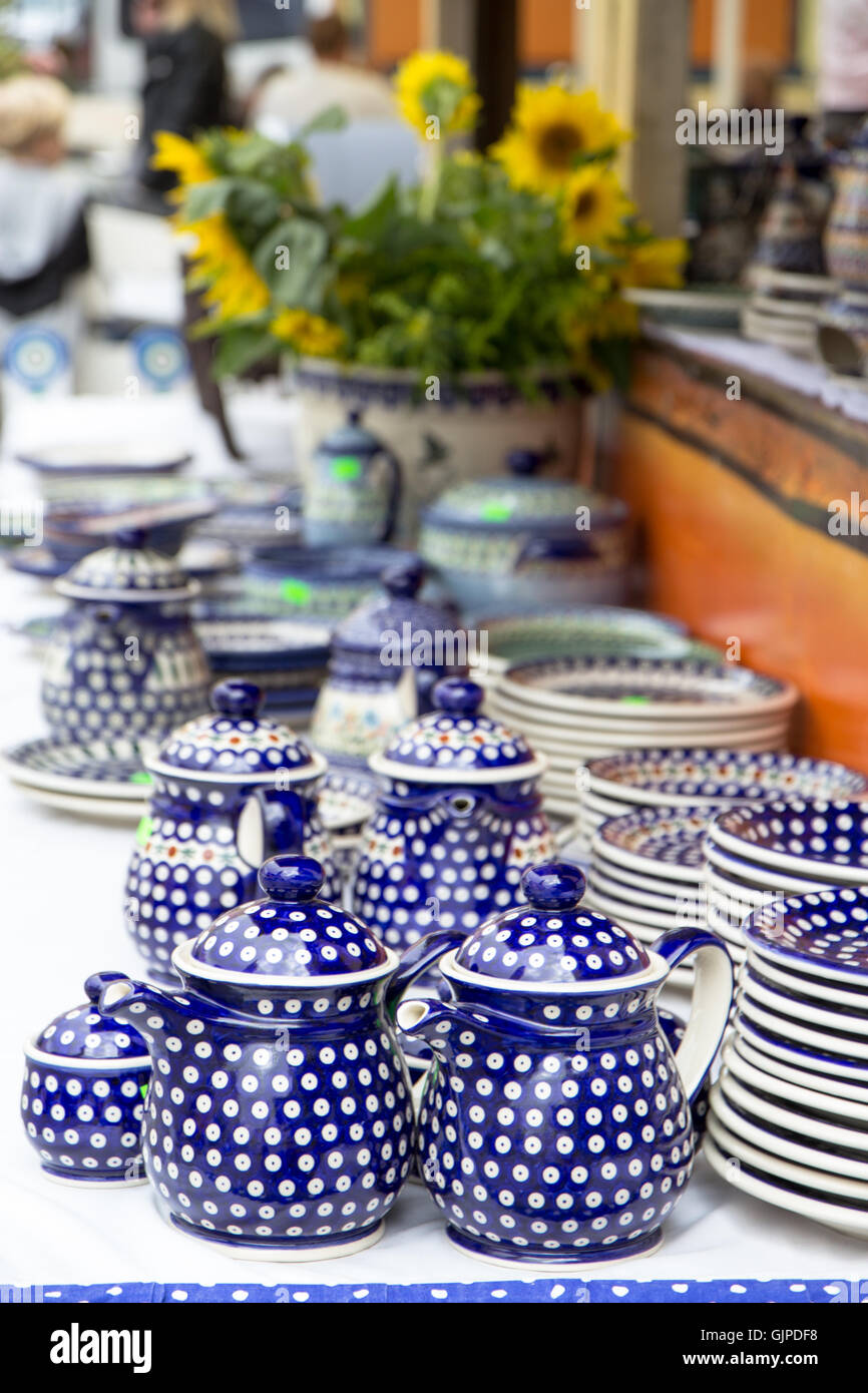 Traditional handmade pottery on the marketplace during Polish Pottery Festival in Boleslawiec, Poland Stock Photo