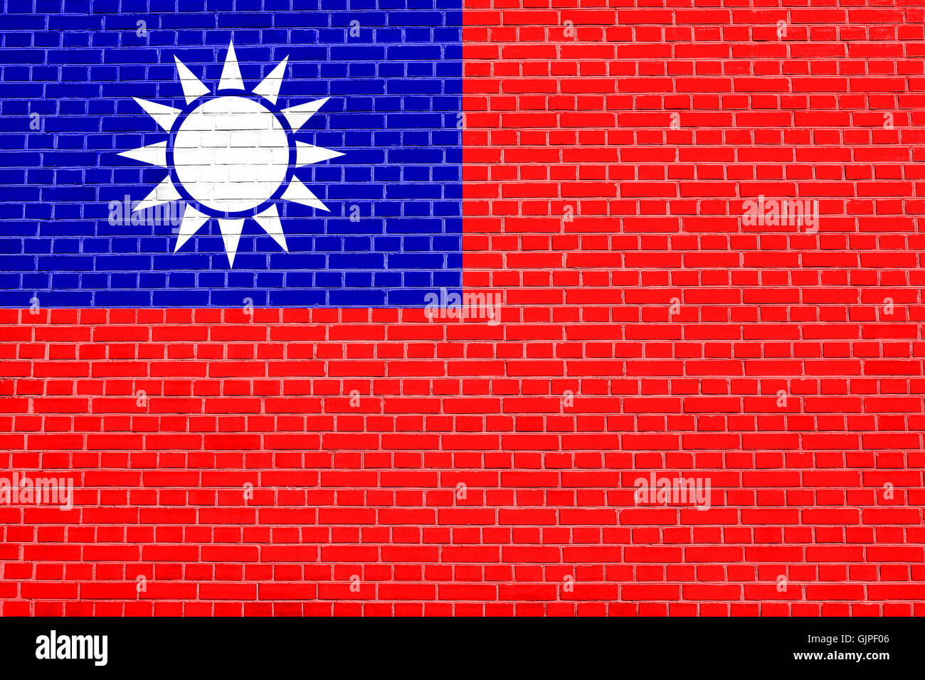 Flag of the Republic of China, ROC, Taiwan, on brick wall texture background. The national flag of Taiwan. Stock Photo