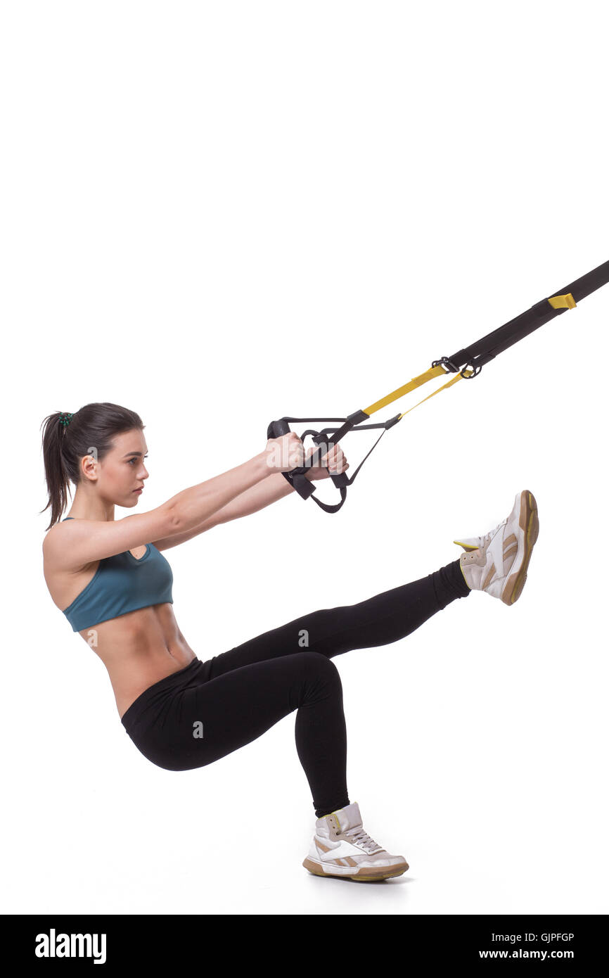 Woman training with suspension trainer sling Stock Photo - Alamy