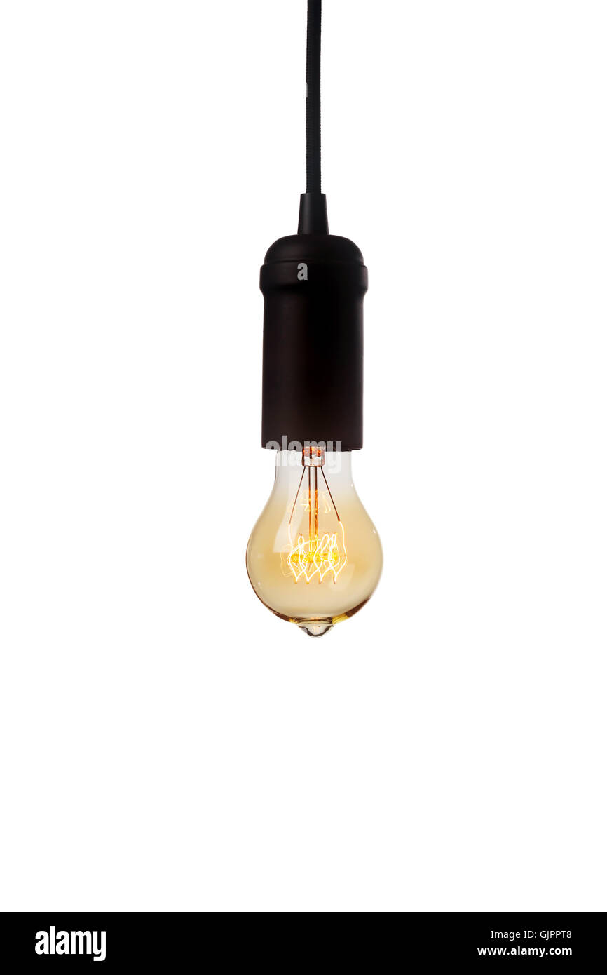 Glowing vintage light bulb isolated on white Stock Photo