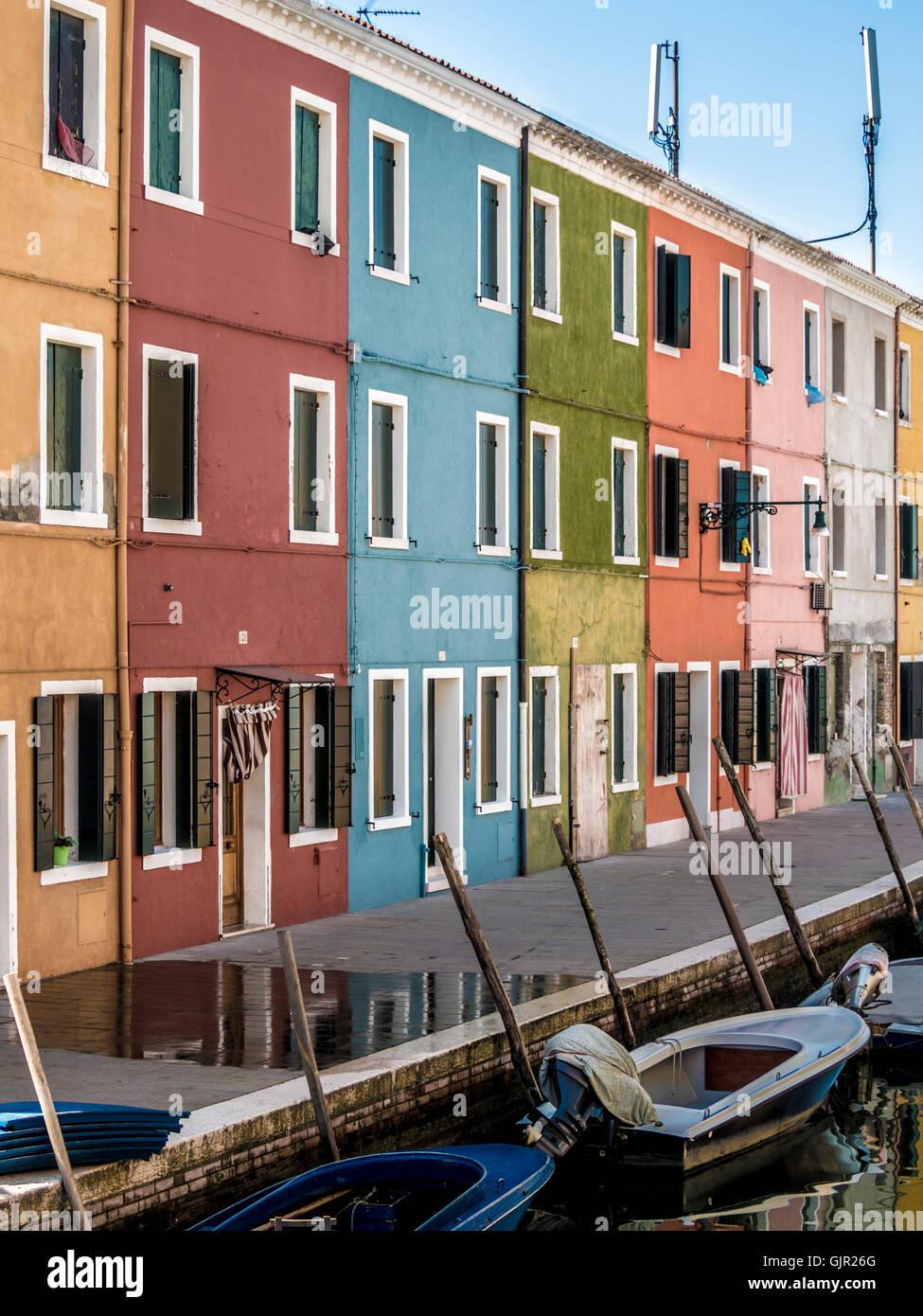 The traditional colourful painted canalside terrace houses on the island of Burano. Venice, Italy. Stock Photo