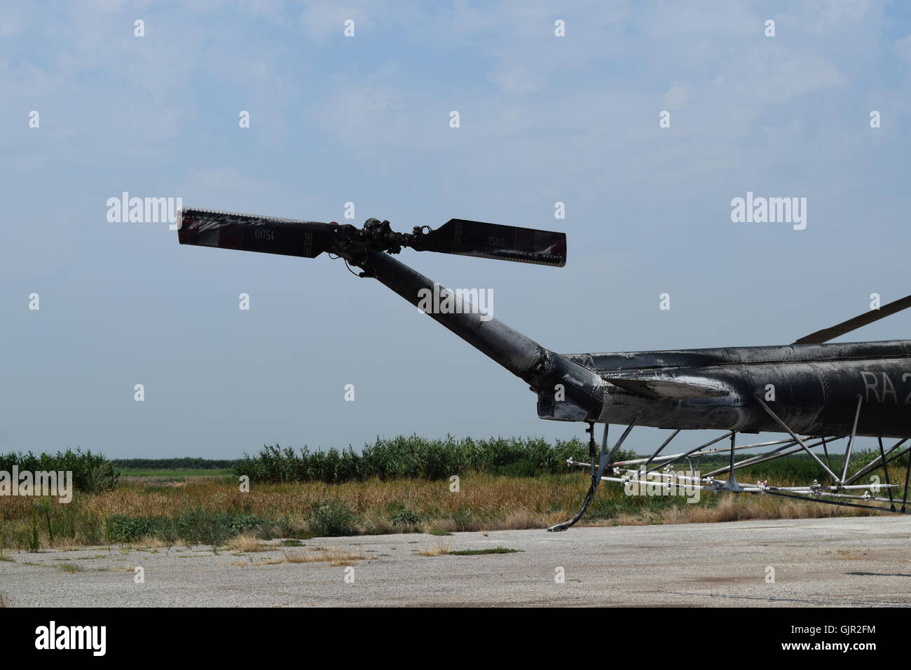 Old helicopter spraying fields. Helicopter spraying fertilizer Stock