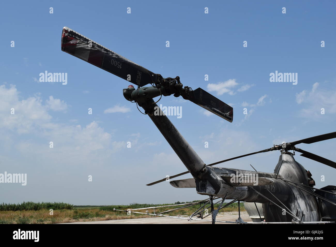 Old helicopter spraying fields. Helicopter spraying fertilizer Stock