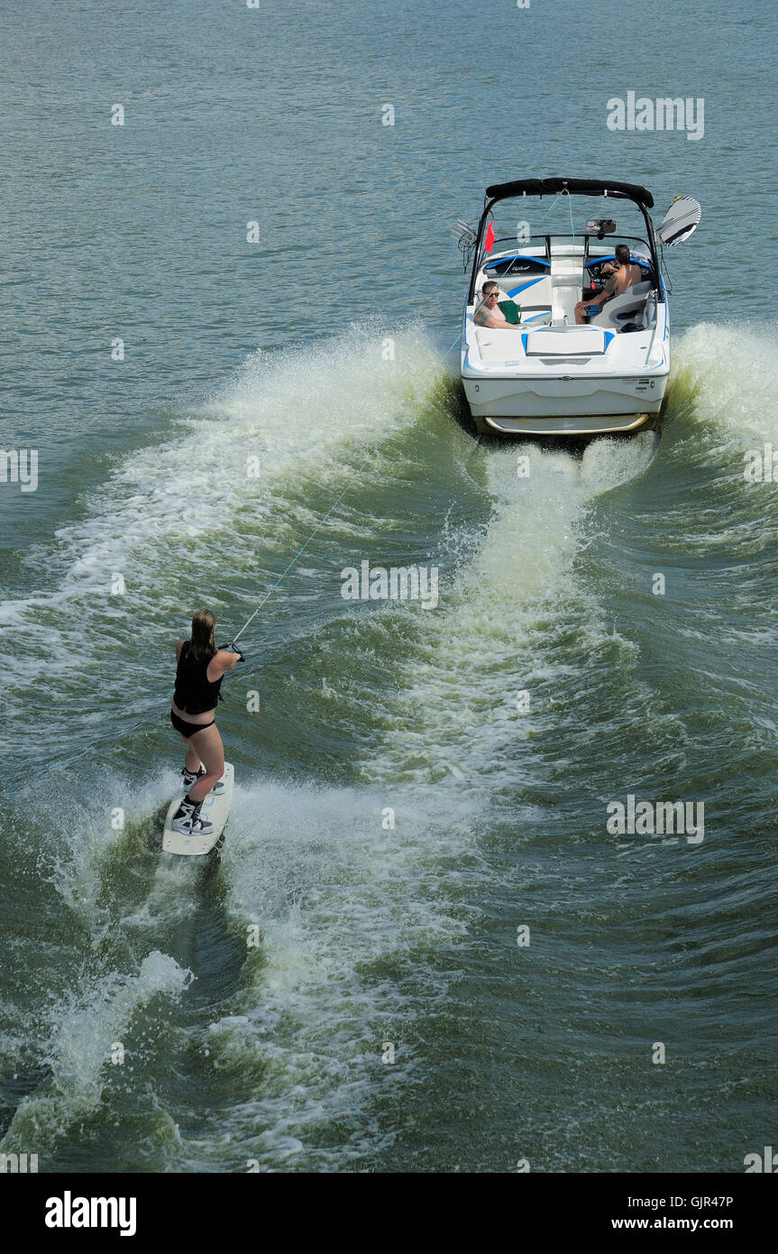 Recreational boating / Wake boarder skiing. Stock Photo
