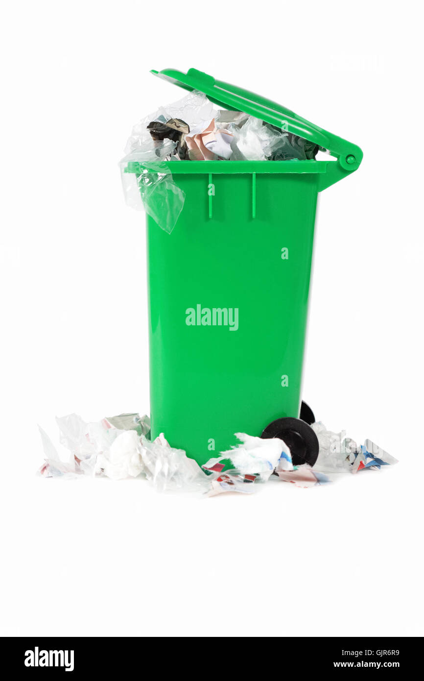 overflowing garbage bin Stock Photo