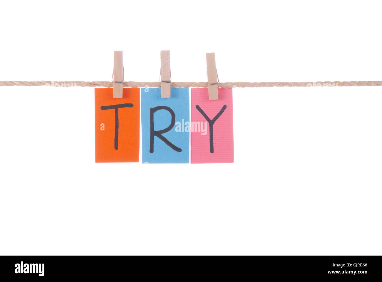 Try, Wooden peg and colorful words Stock Photo Alamy