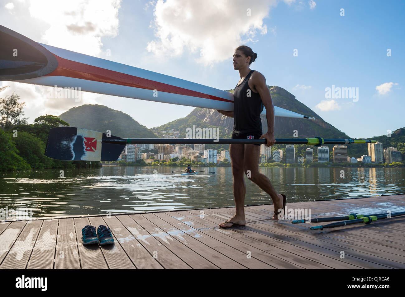 RIO DE JANEIRO - MARCH 14, 2016: Rower carries a shell back to the ...