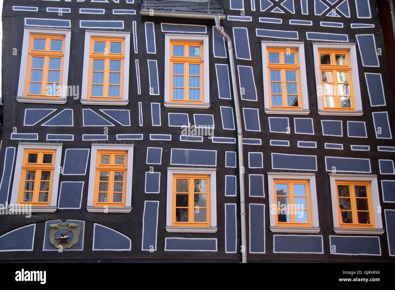 half-timbered house with yellow windows Stock Photo