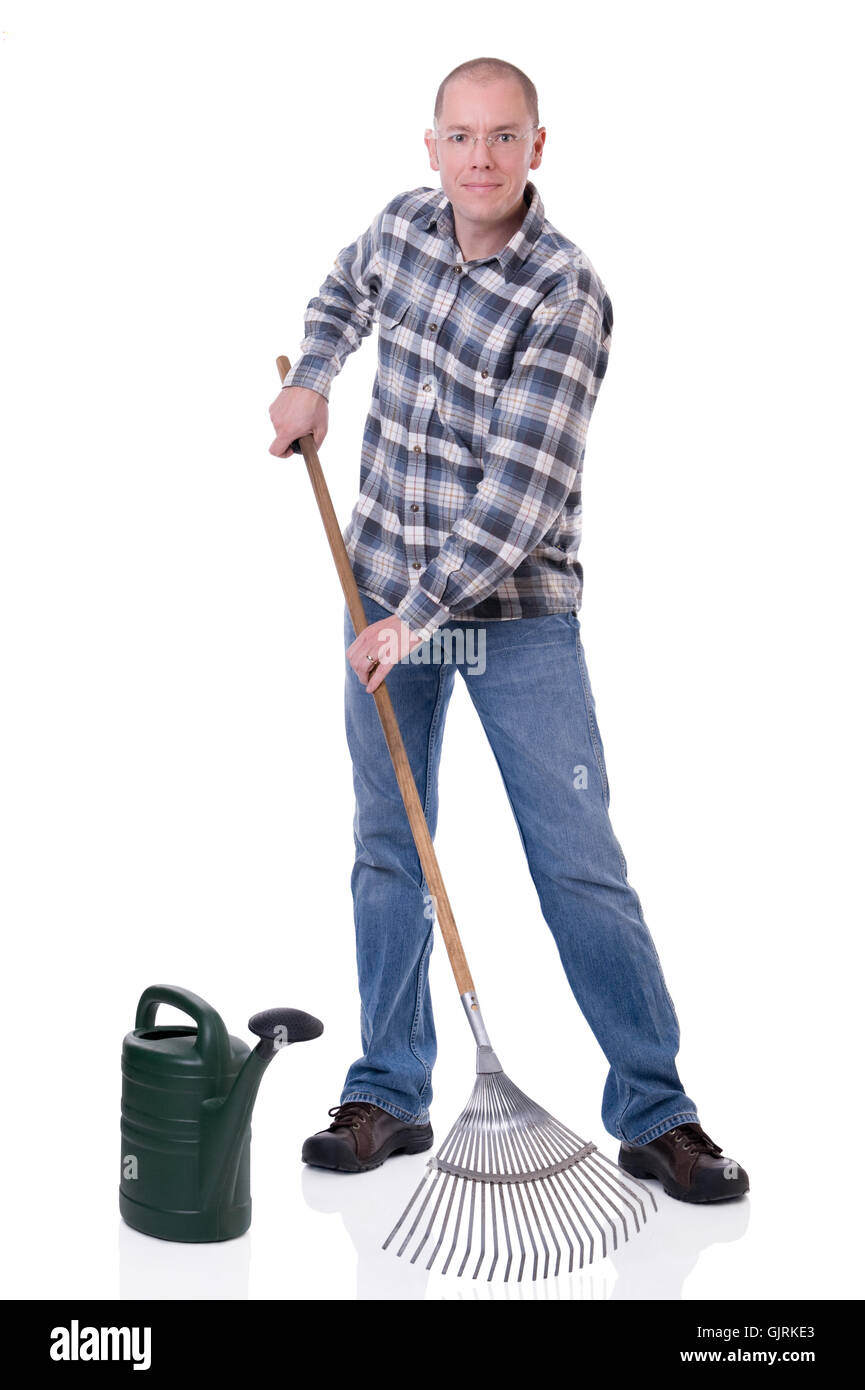 man with watering can and rake Stock Photo