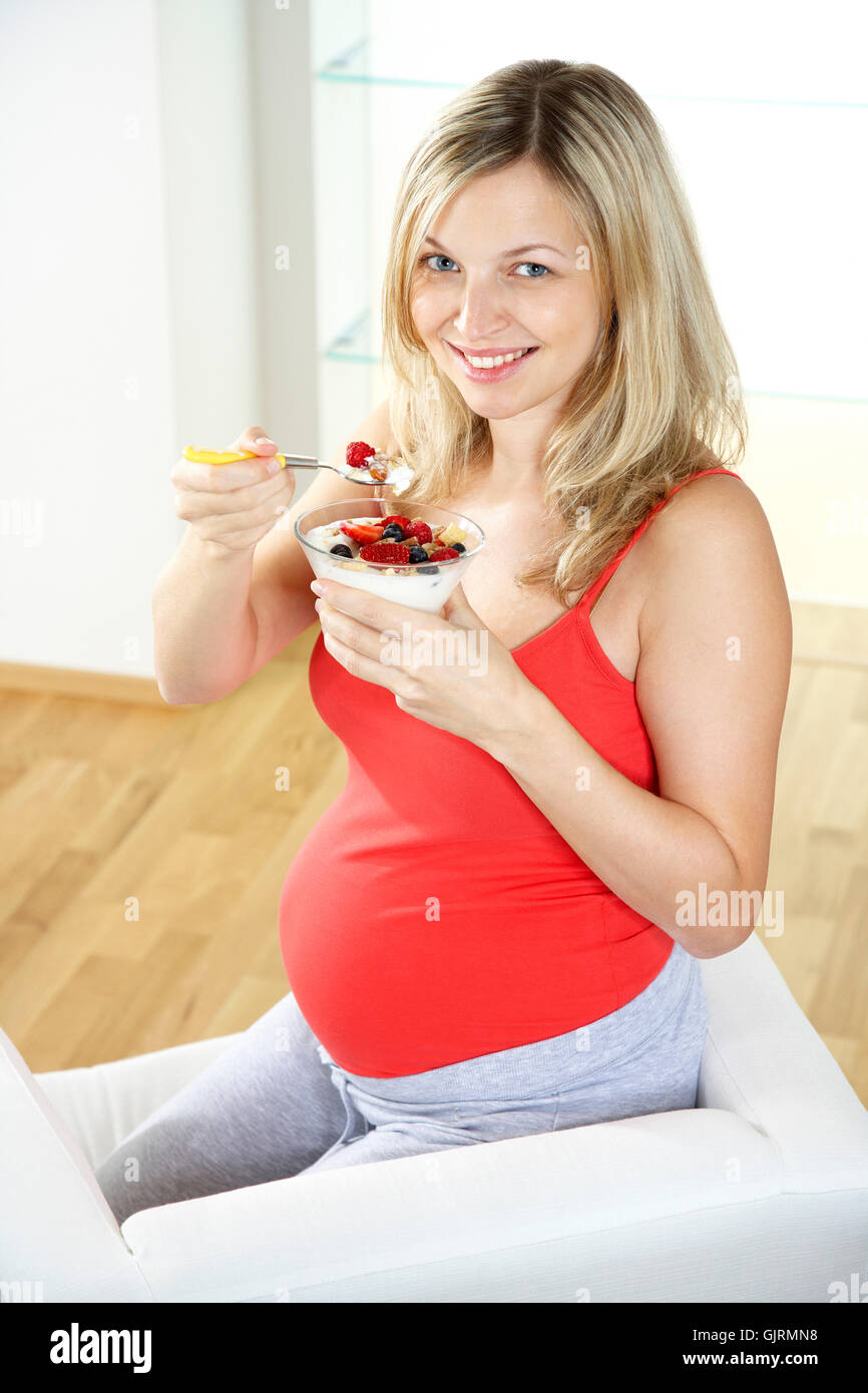 young pregnant woman eating cereals Stock Photo Alamy