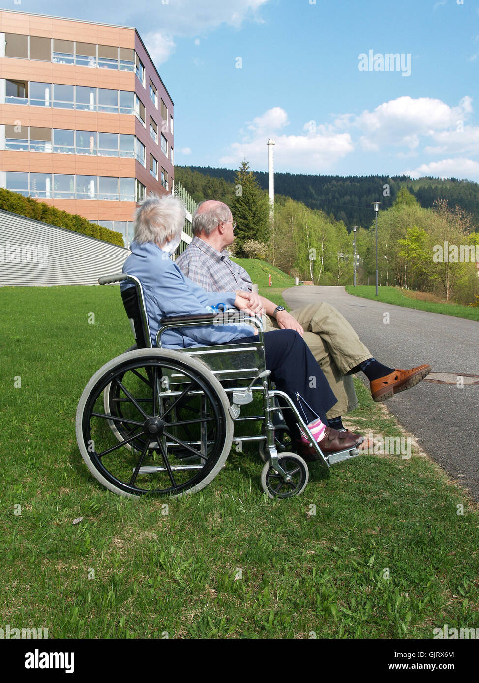 wheelchair assistance help Stock Photo