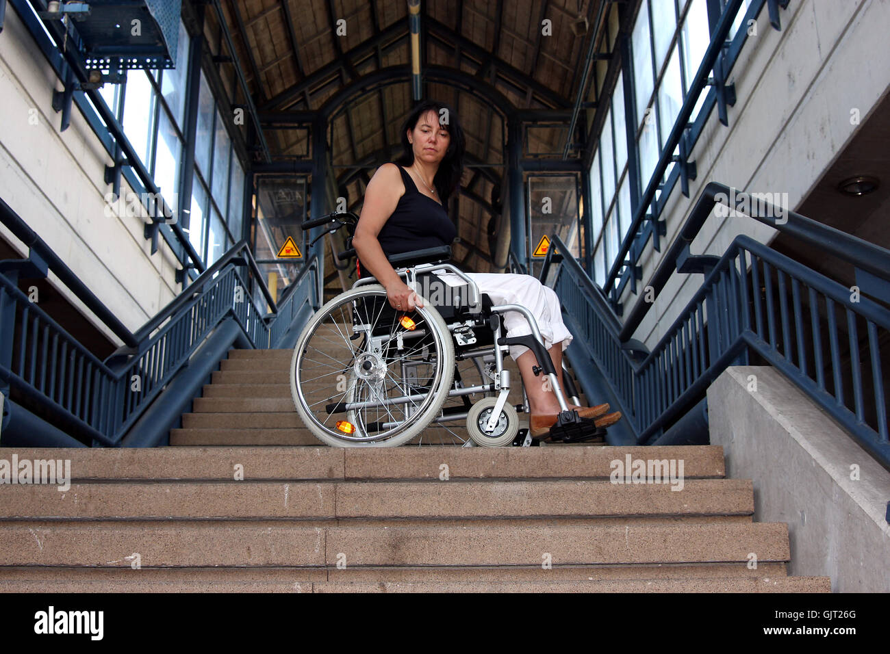 Woman in wheelchair on stairs hi-res stock photography and images - Alamy