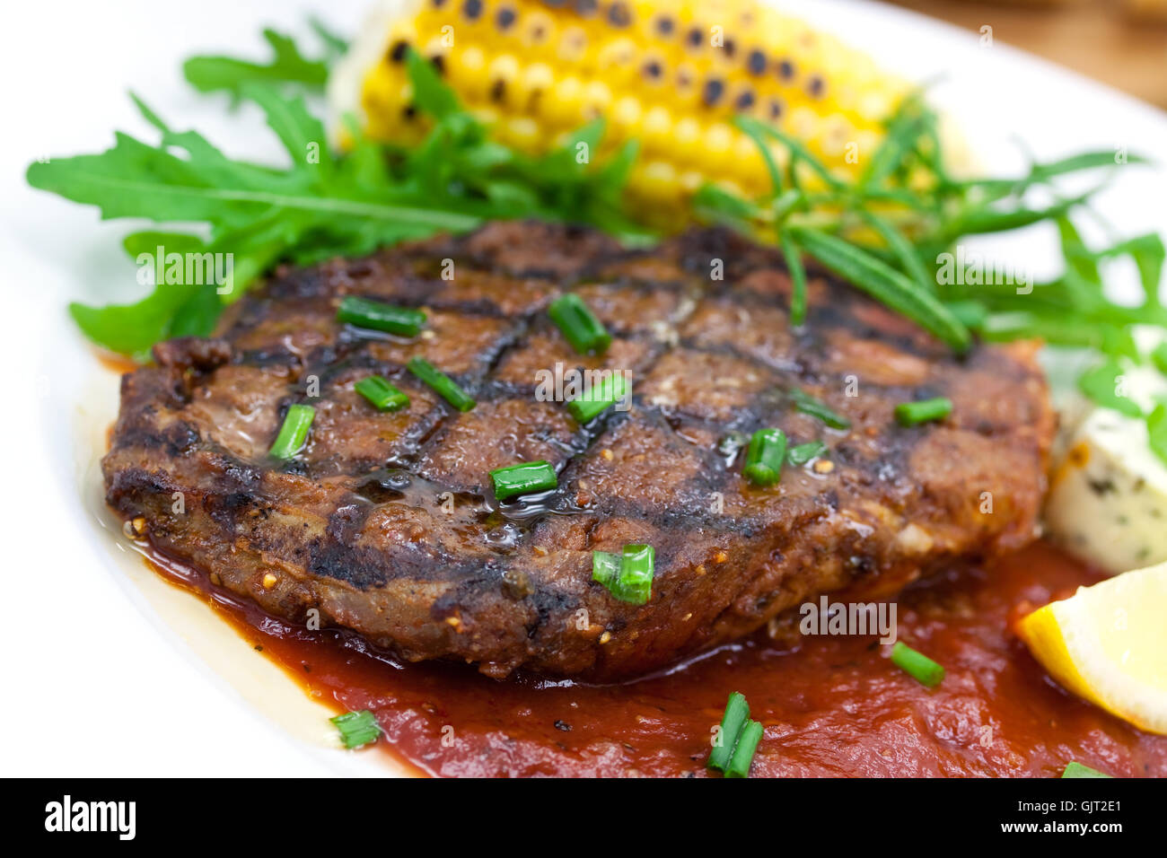 rib eye steak with rocket salad Stock Photo - Alamy
