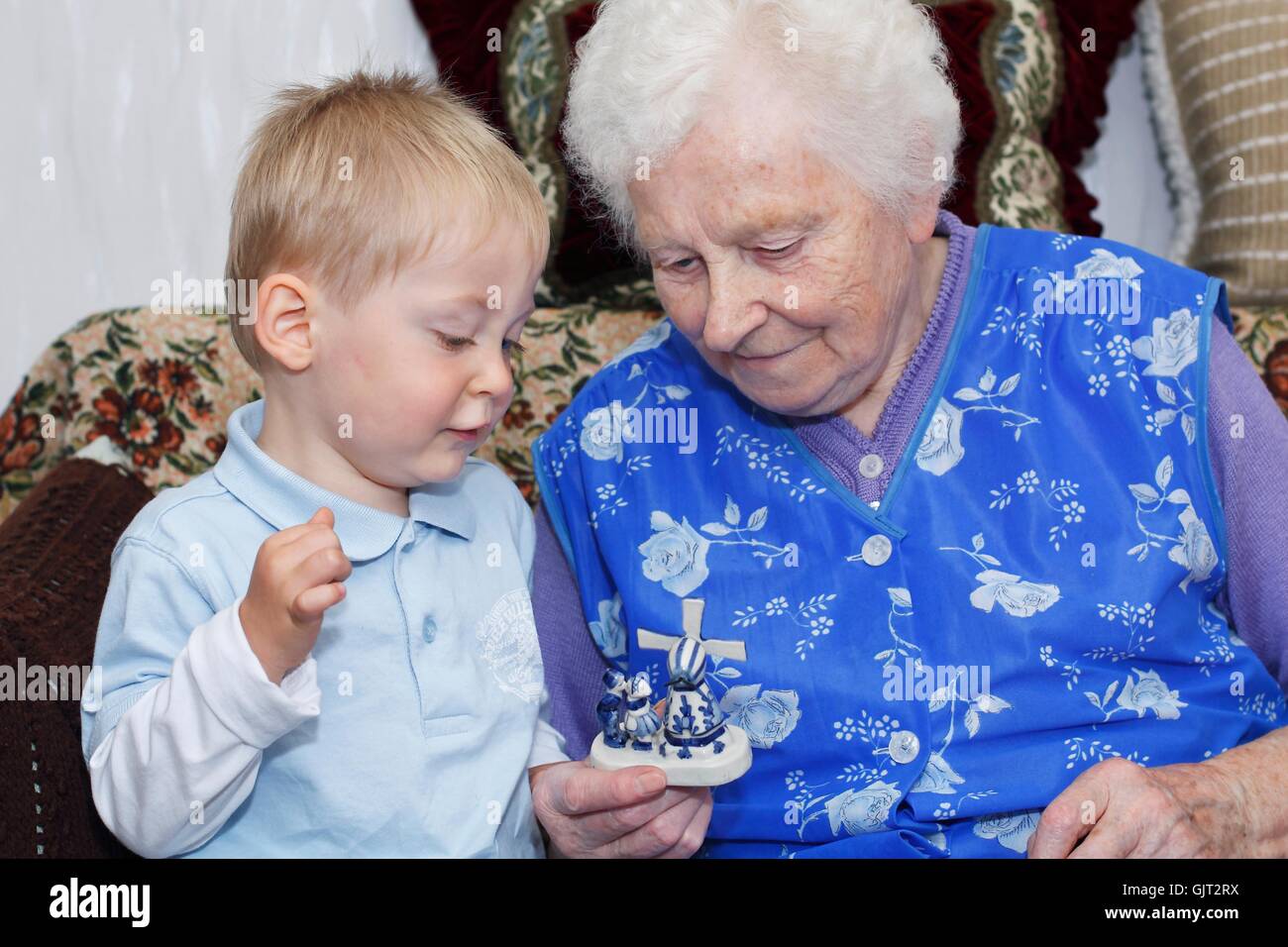 grandson playing with grandma Stock Photo