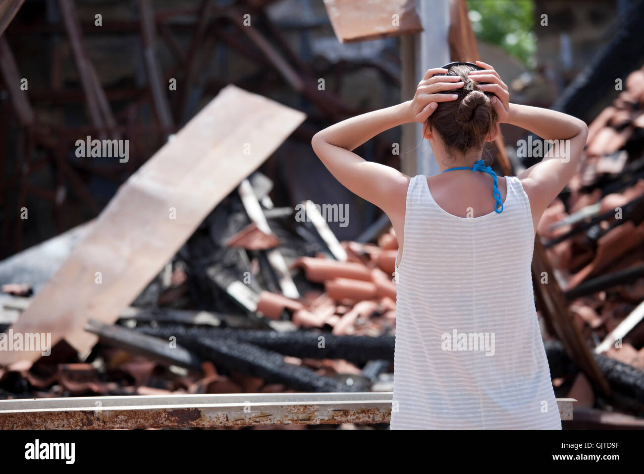 woman-in-front-of-burned-house-stock-photo-alamy
