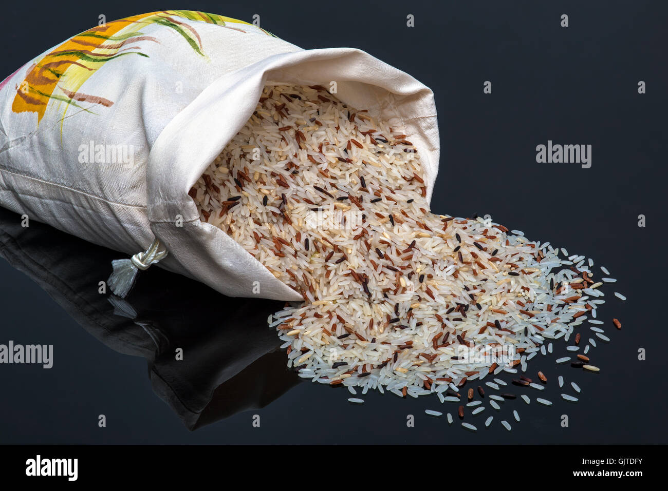 multi organic Jasmine rice, closeup on black background Stock Photo