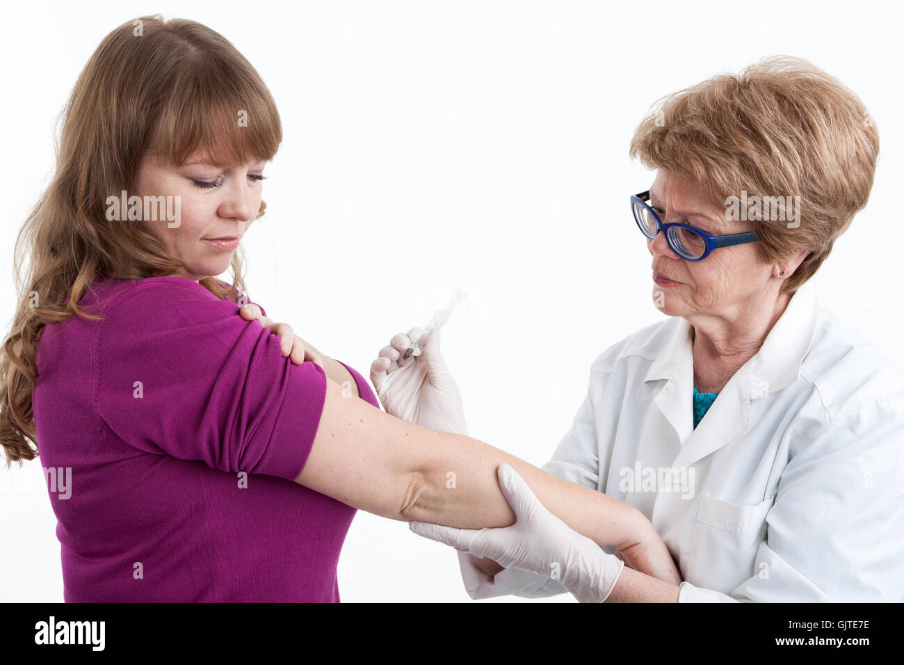 How Inoculation Done Nurse do an inoculation the young woman, white background Stock Photo ...