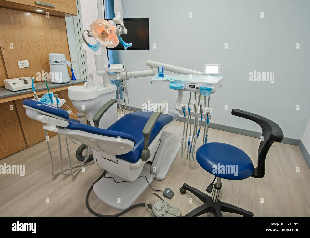 Interior design of dentist surgery room in medical clinic with chair