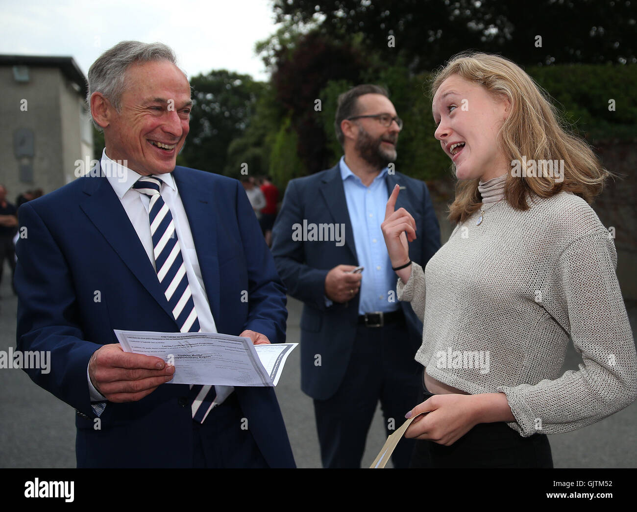 Minister for Education and Skills Richard Bruton with Molly Power from Marino after she collected her Leaving Certificate exam results at Mount Temple School in Dublin. Stock Photo
