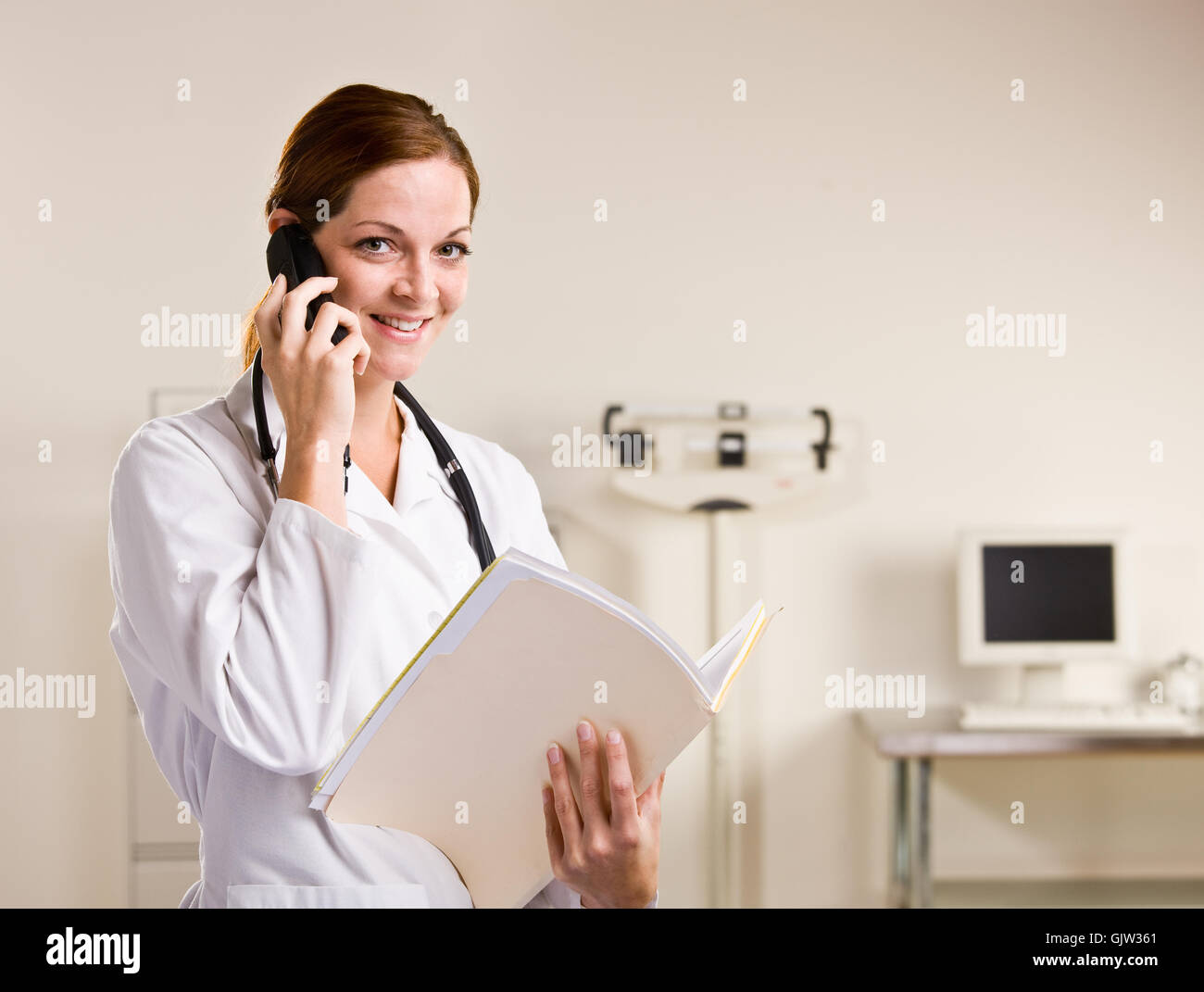 Female doctor smiles speaking hi-res stock photography and images - Alamy
