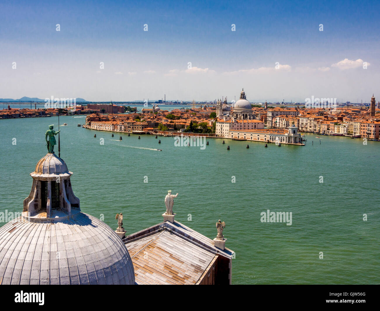 Aerial view of the dome and roof of San Giorgio Maggiore church with mainland Venice and the islan of Giudecca in the background Stock Photo
