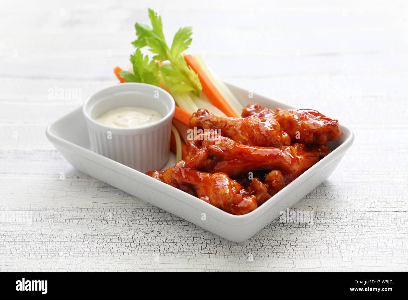 Buffalo wings with sauce hi-res stock photography and images - Alamy