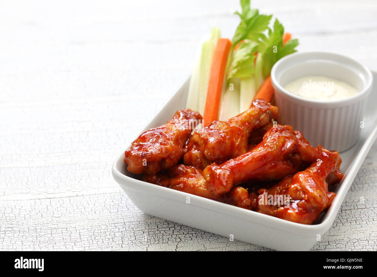 Buffalo wings with sauce hi-res stock photography and images - Alamy
