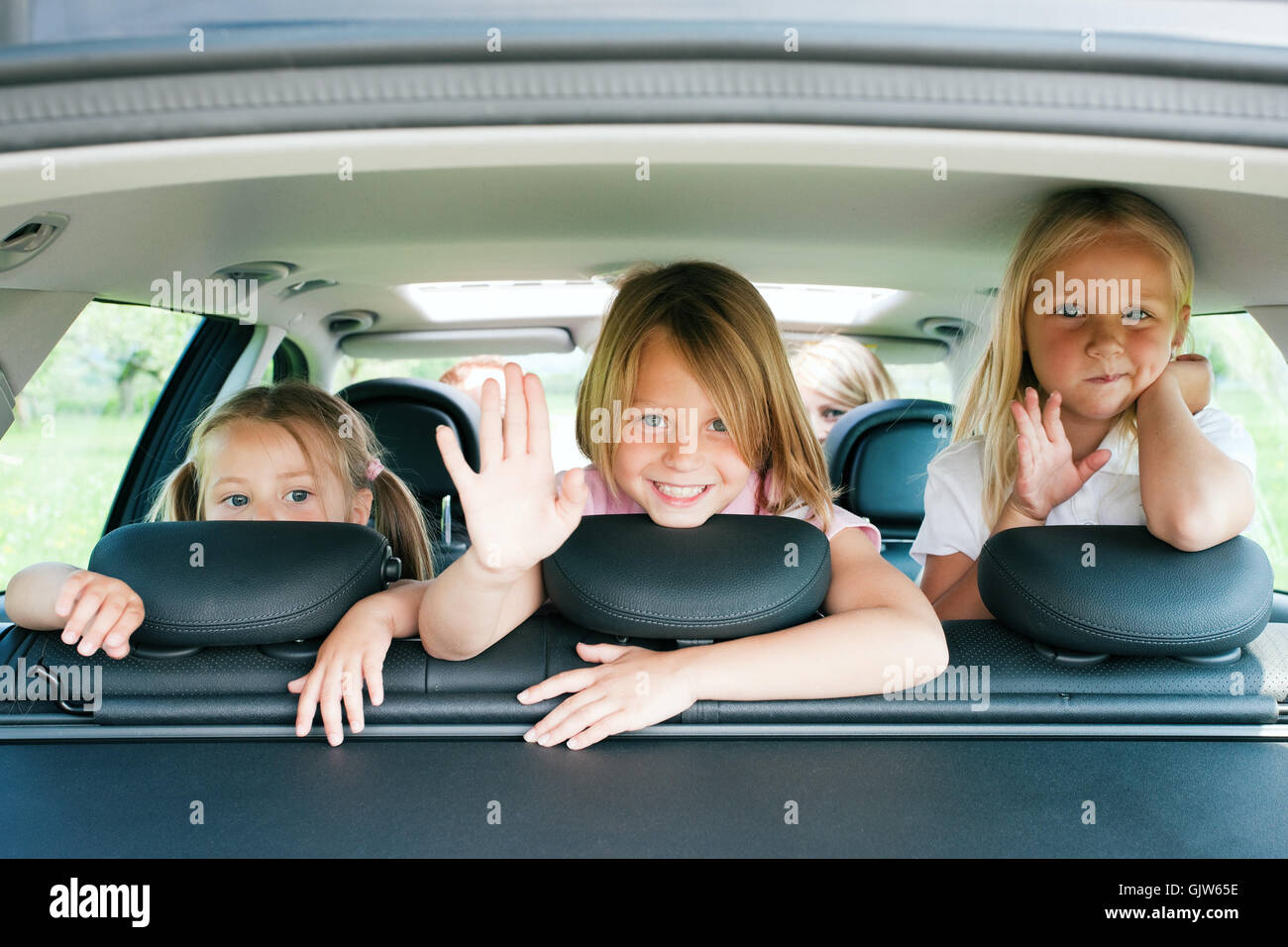family traveling in car Stock Photo Alamy