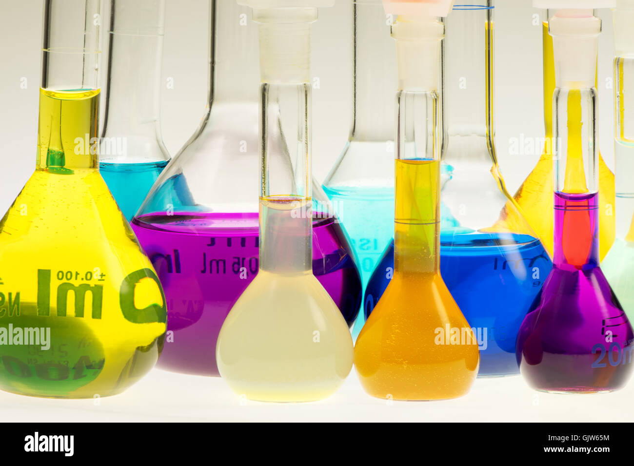 chemical flasks with colored solutions