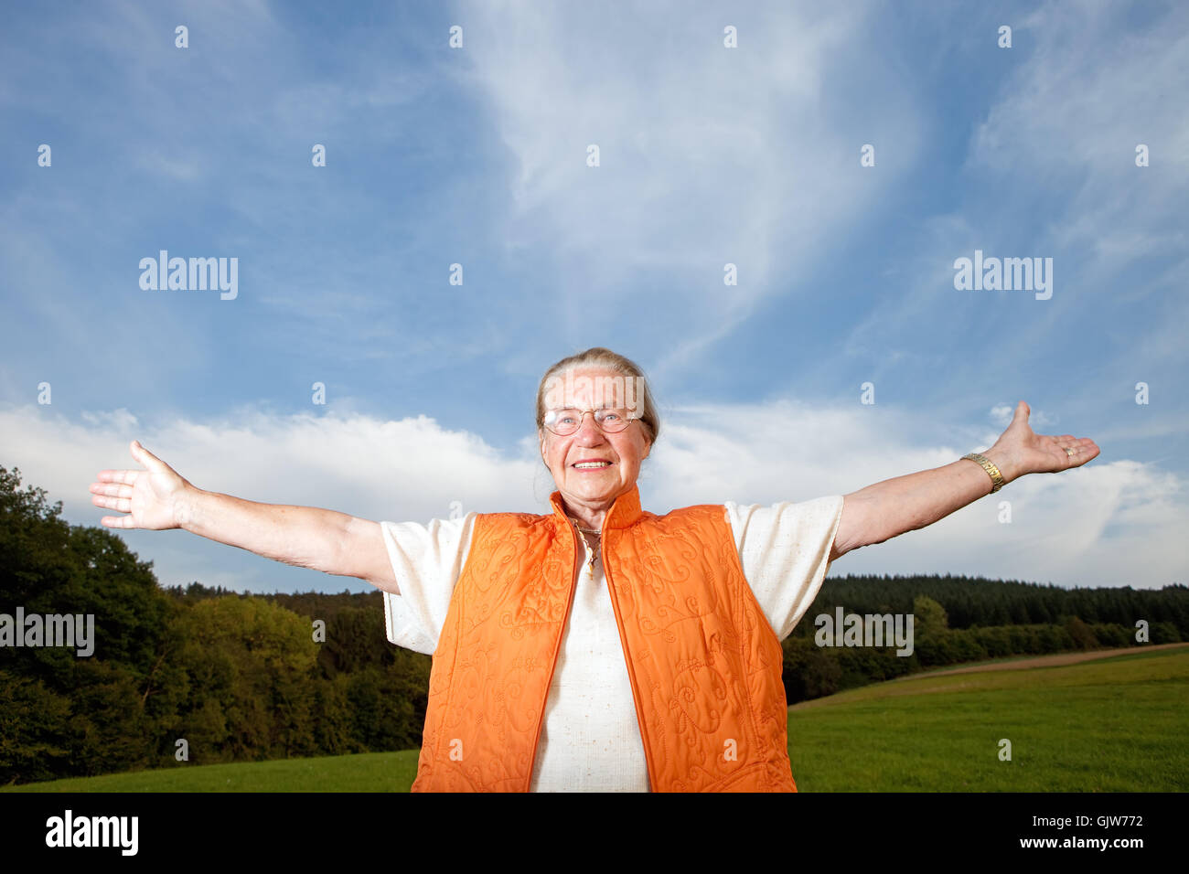 Happy old woman spread hi-res stock photography and images - Alamy