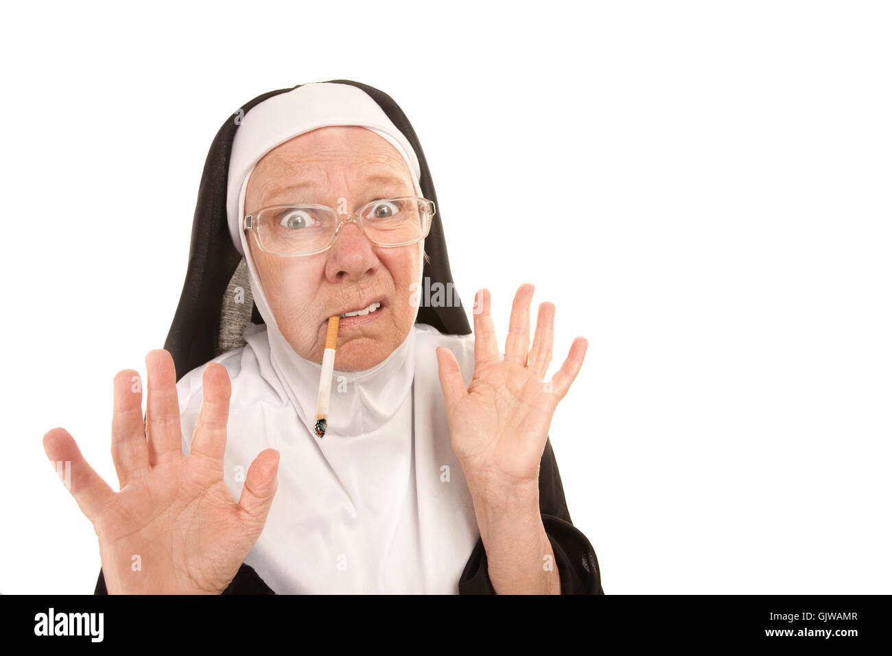 nun smoking a cigarette Nun smoking cigarette cigarette hi-res stock photography and images
