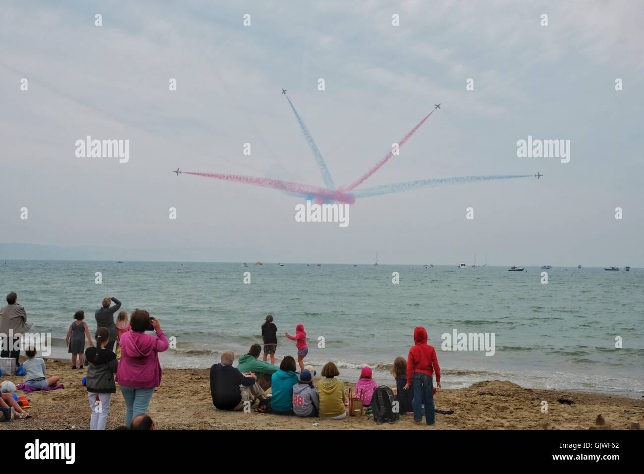 Red Arrows, Weymouth, Dorset, UK. 17th Aug, 2016. The RAF Red perform their famous arial display in front of thousands of holiday makers on Weymouth seafront at the hugely popular Weymouth Carnival. Credit:  Tom Corban/Alamy Live News Stock Photo