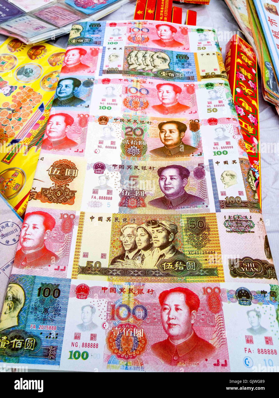Anyang, Anyang, China. 17th Aug, 2016. Anyang, CHINA- August 16 2016: (EDITORIAL USE ONLY. CHINA OUT) False paper money at the market of offering. Various weird offerings including fake iPhones, villas, false paper money and cigarettes are on sale in Hua County, central ChinaÂ¡Â¯s Henan Province, before the traditional Zhongyuan Festival comes. Chinese traditional Zhongyuan Festival, also known as Ghost Festival, is celebrated on 15th day of the seventh lunar month. People usually burn incense and paper money as an offering to the spirits of deceased ancestors during the festival. (Credit I Stock Photo