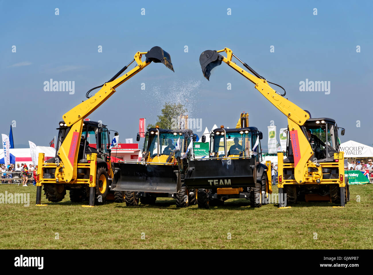Gillingham & Shaftesbury Agricultural Show, Motcombe Turnpike Showground, Dorset, UK.17th August 2016. The Diggerland Dancing Digger Stunt Team entertains the crowd on a hot summers day at the Gillingham & Shaftesbury Agricultural Show Credit:  Andrew Harker/Alamy Live News Stock Photo