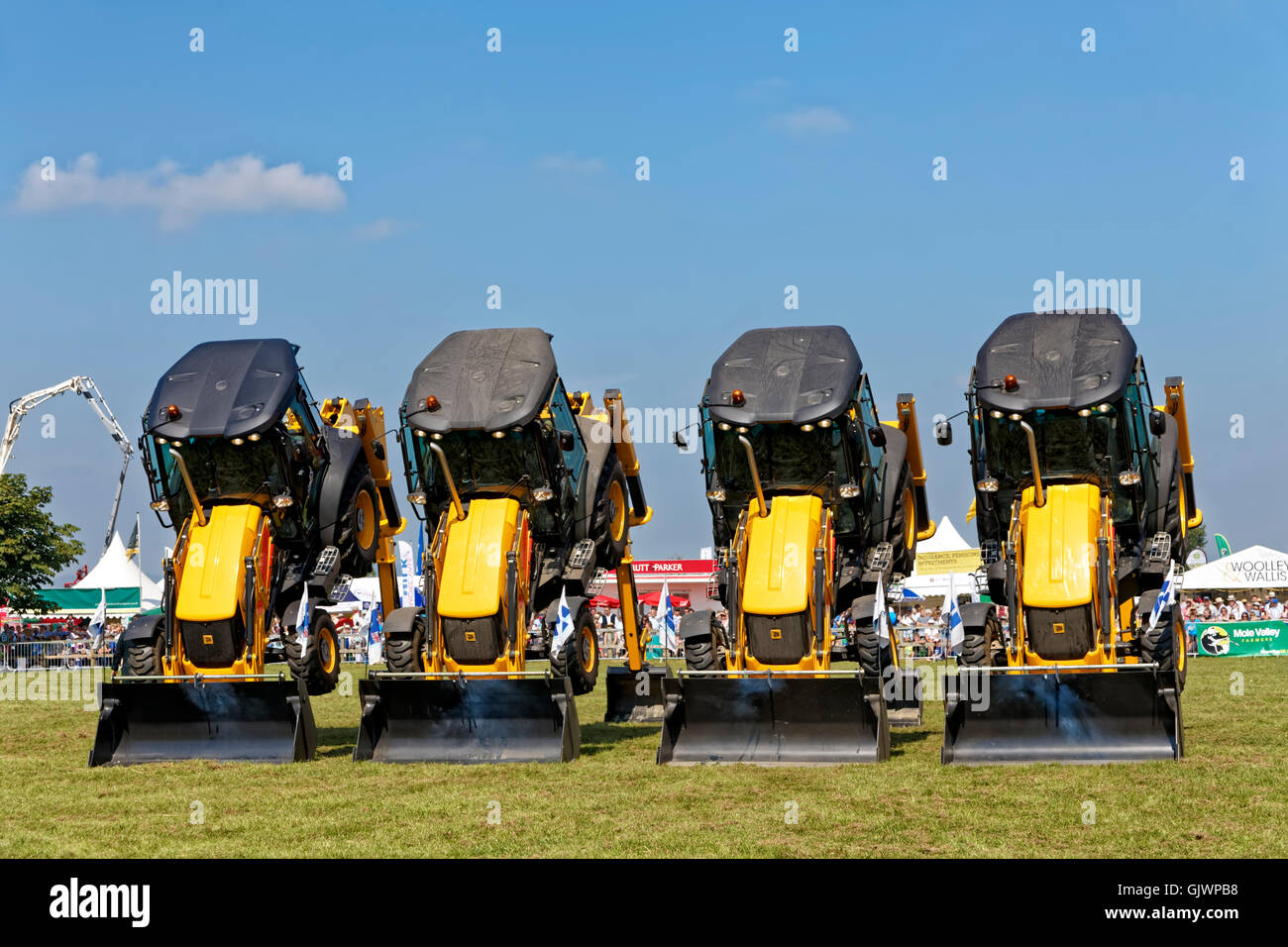 Gillingham & Shaftesbury Agricultural Show, Motcombe Turnpike Showground, Dorset, UK.17th August 2016. The Diggerland Dancing Digger Stunt Team entertains the crowd on a hot summers day at the Gillingham & Shaftesbury Agricultural Show Credit:  Andrew Harker/Alamy Live News Stock Photo