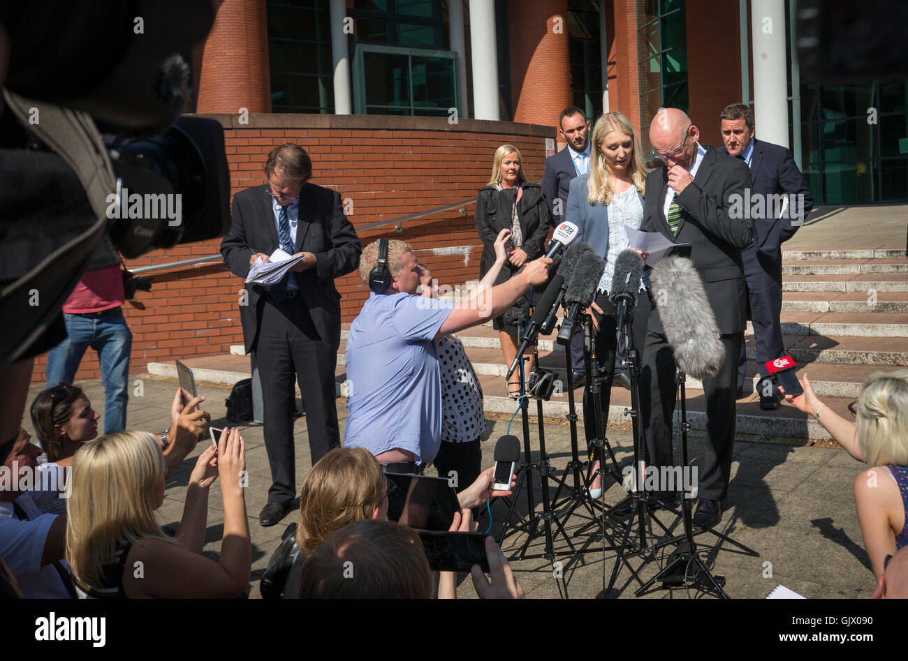 Ian Johnston, partner of murder victim Sadie Hartley, stands with his daughter Hannah, as he issues a statement outside Preston Crown Court, after his 'bunny boiler' ex was jailed for life and ordered to serve a minimum of 30 years in jail for the gruesome stun gun murder of her love rival. Stock Photo